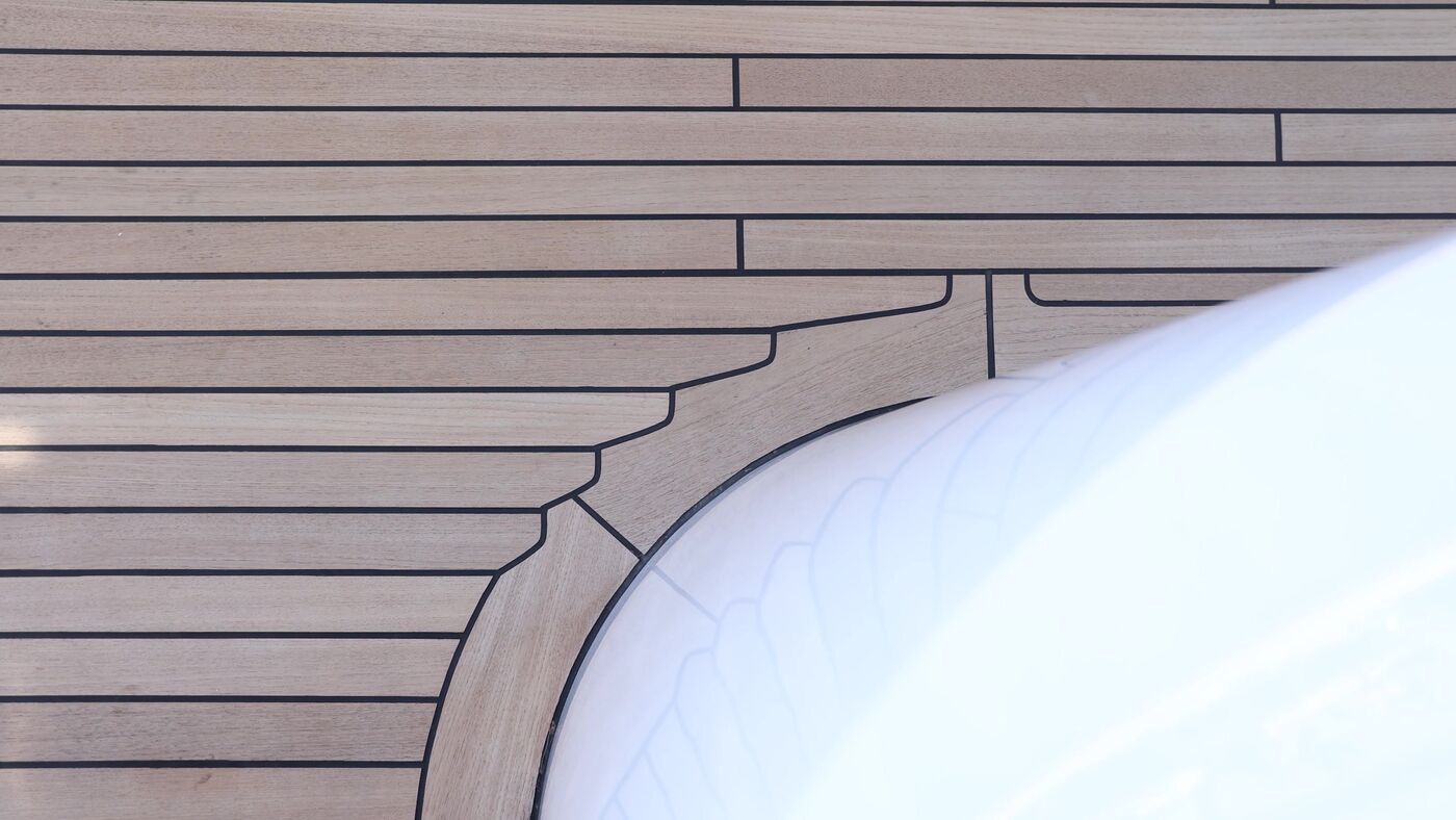 Curved teak margin plank